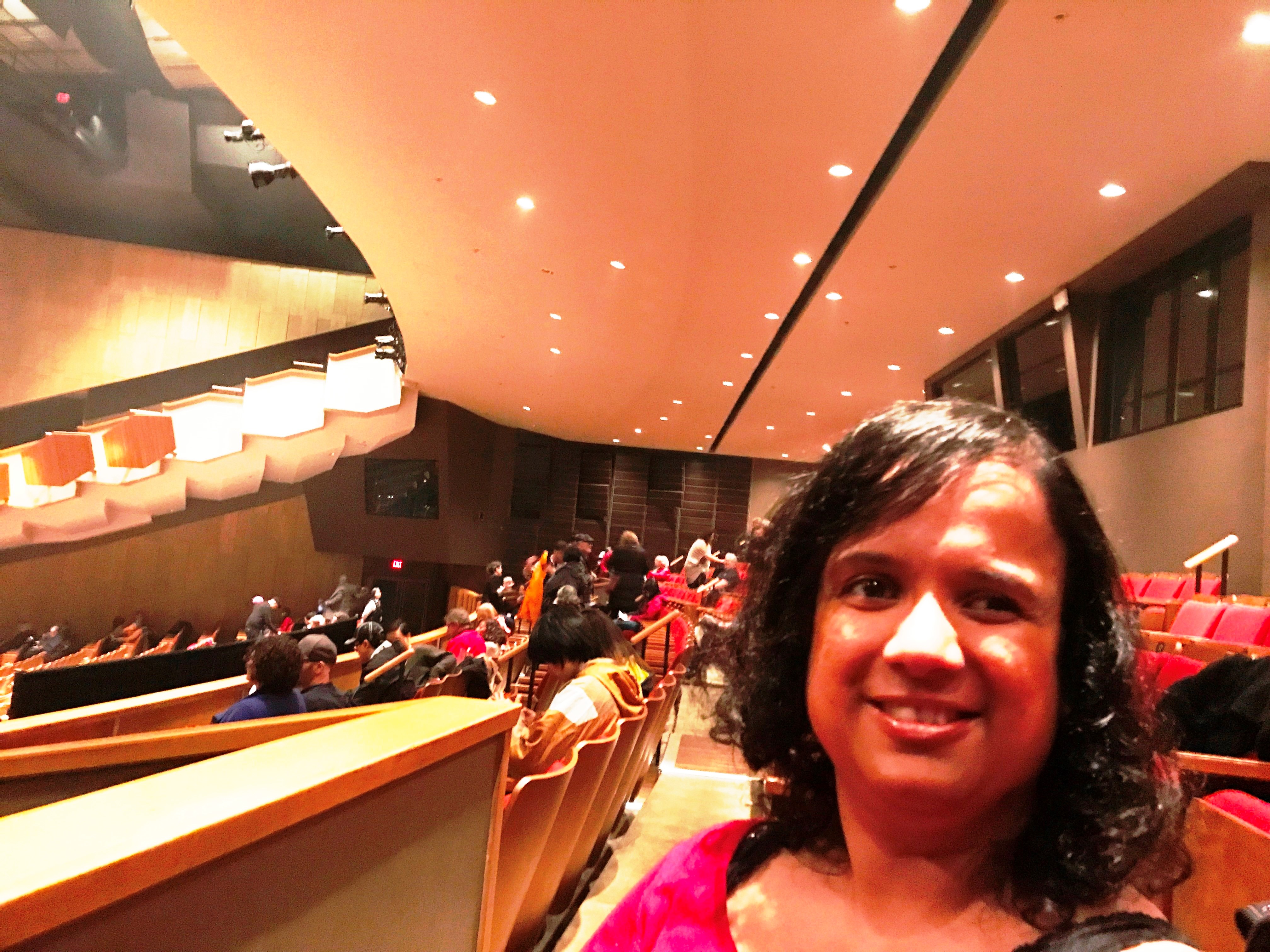 Kristy sitting in the mezzanine at the Queen Elizabeth Theatre