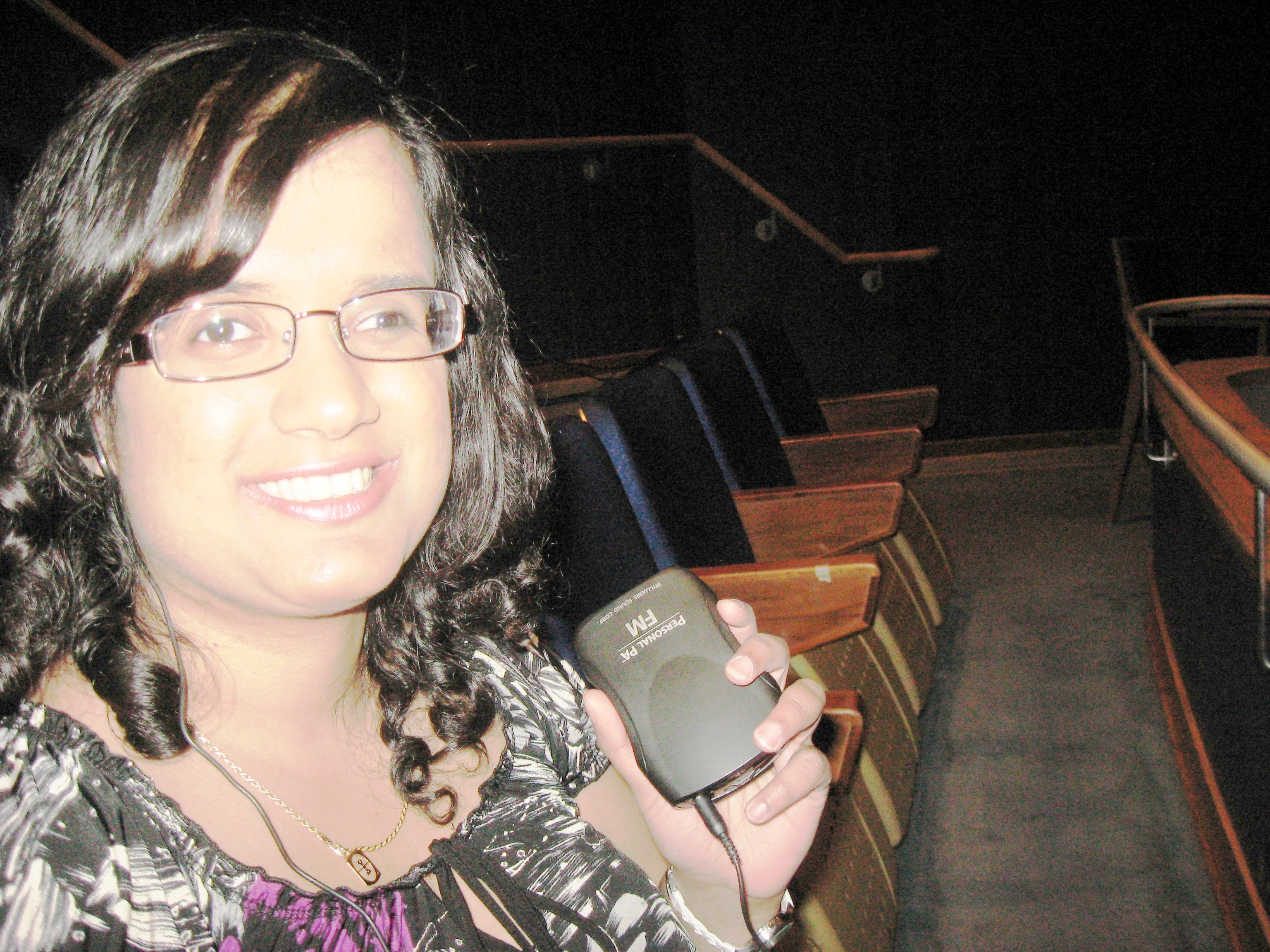 Kristy, receiver in hand, at her first Vocaleye performance in 2010