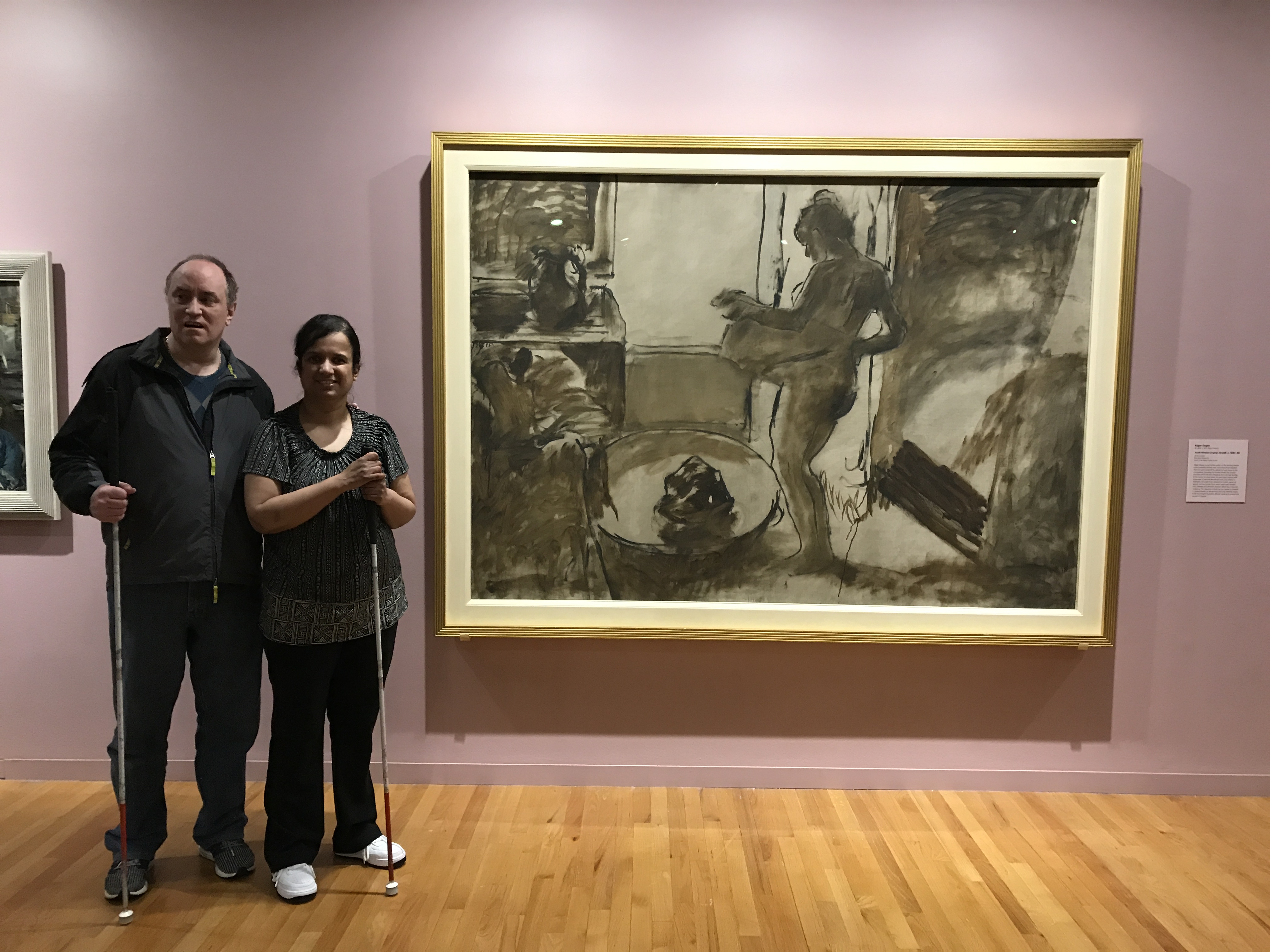 Kristy and Shawn beside one of the paintings by the French masters